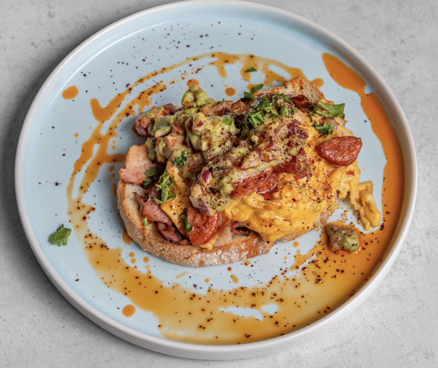 Scrambled eggs with chorizo and avocado on sourdough